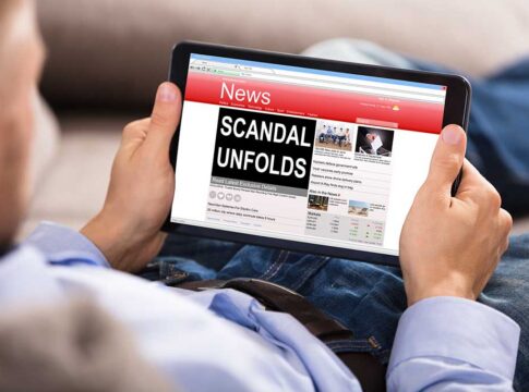 Person reading news website on tablet