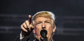 I dont know who this is person pointing during a speech.