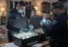 FBI agents examining evidence in a home setting